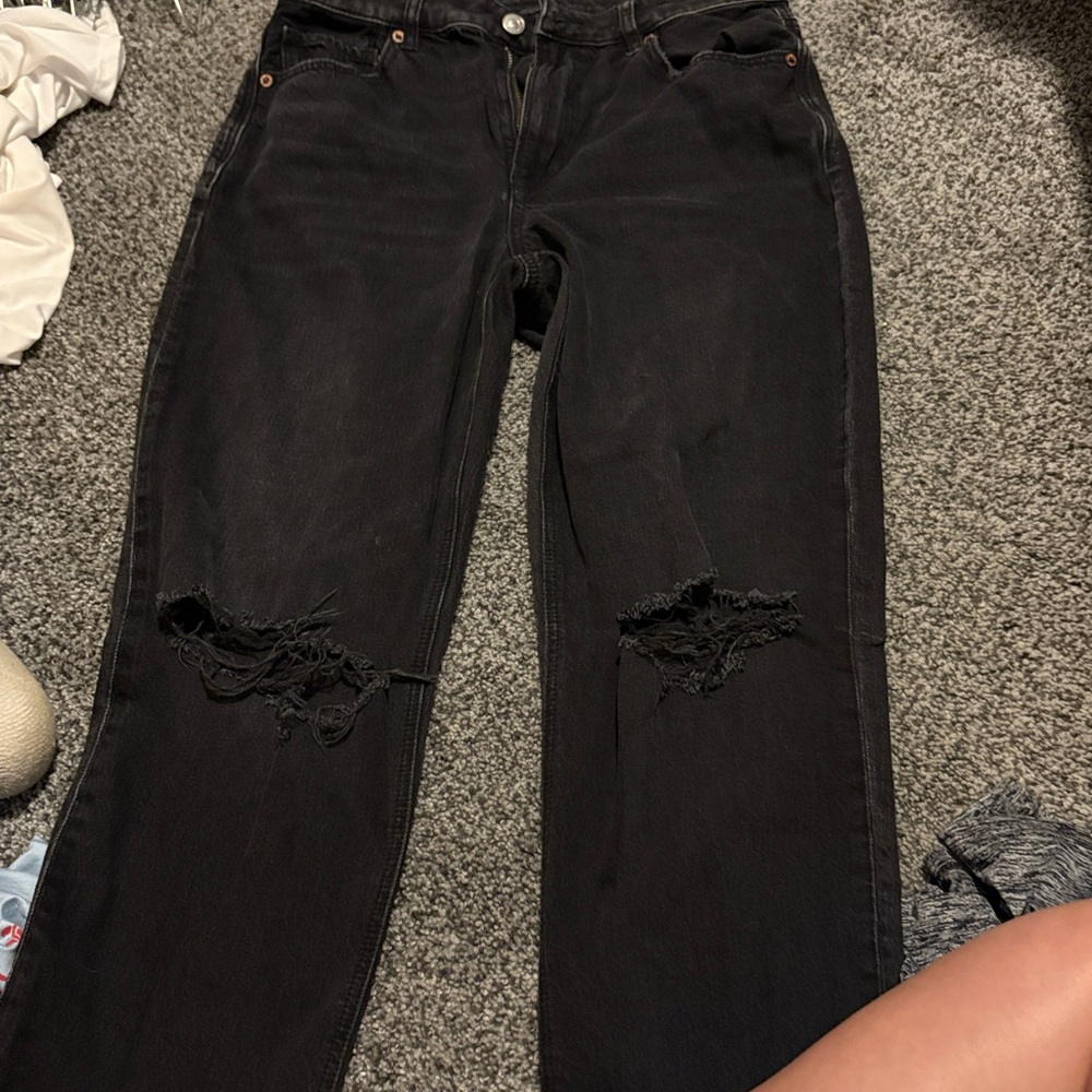 another pair of black ripped american eagle jeans straight leg